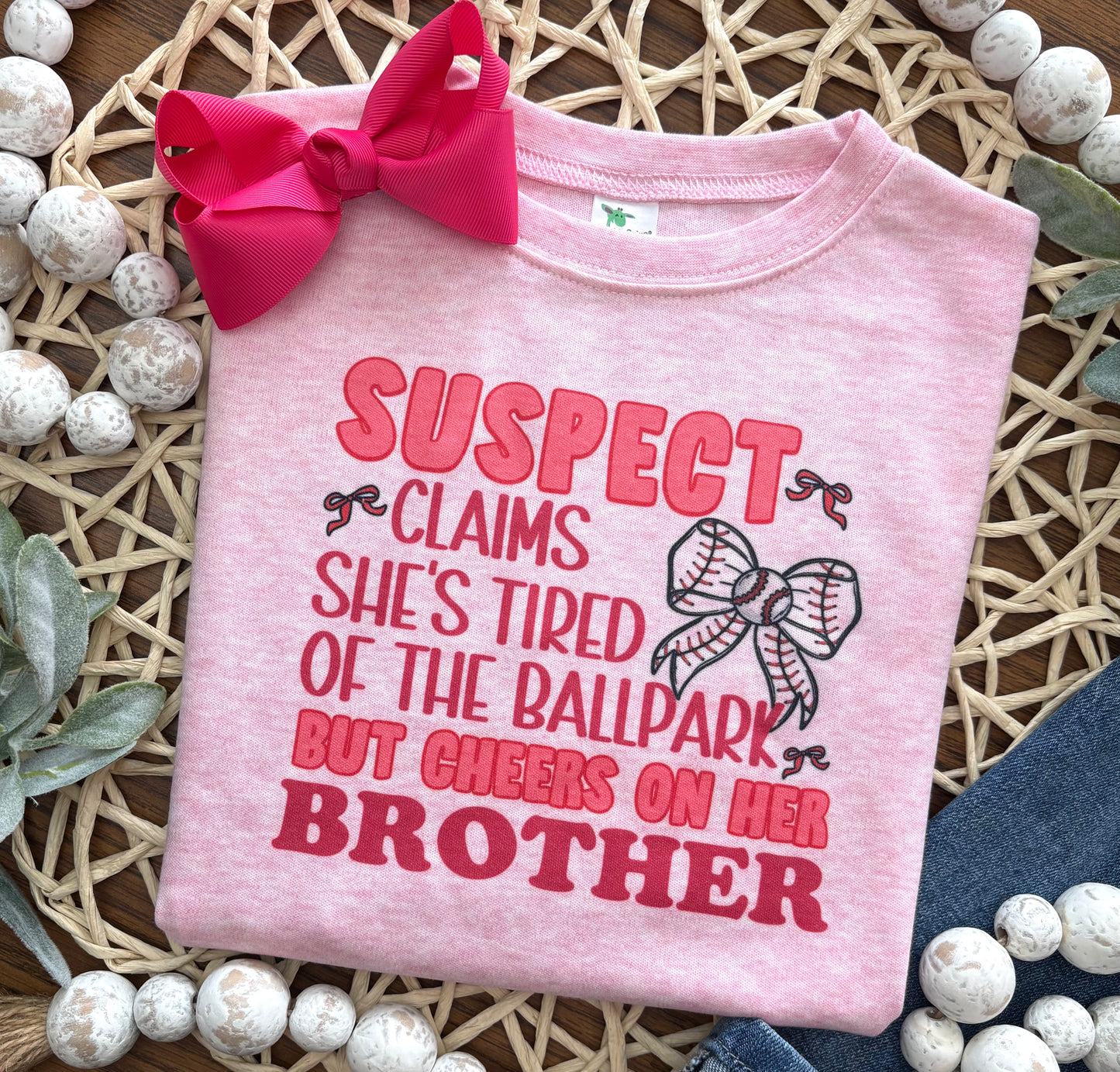 Suspect Cheers for Her Brother on Pink