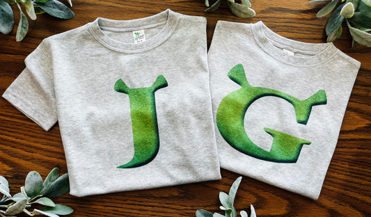 Green Initial on Grey